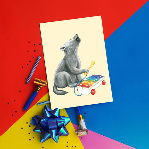 Baby Wolf playing xylophone- Greeting Card