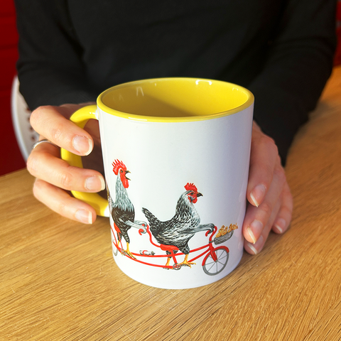 Rooster, hen and chicks riding a tandem bicycle Mug