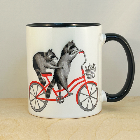 Raccoons riding a Bike Mug