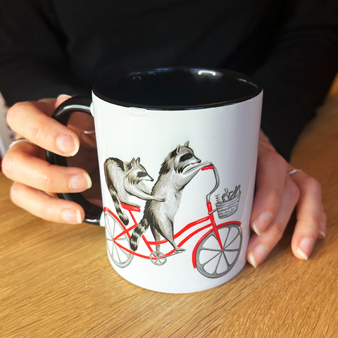 Raccoons riding a Bike Mug