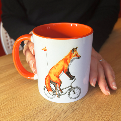 Fox riding a Bike Mug