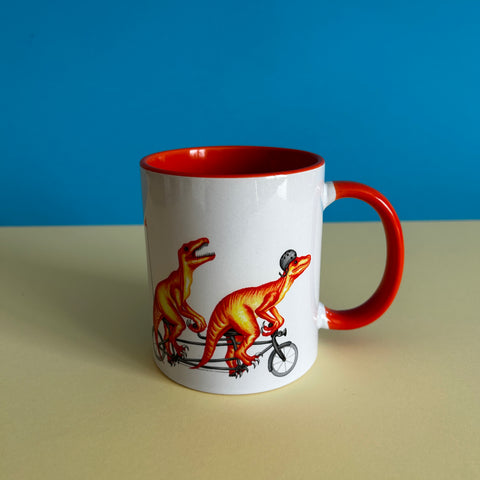 Velociraptors riding a bike mug