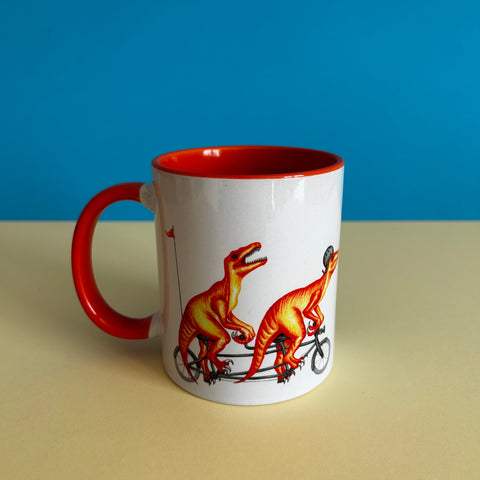 Velociraptors riding a bike mug