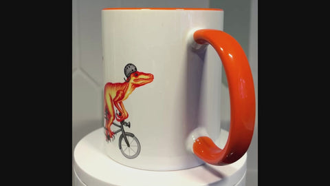 Velociraptors riding a bike mug