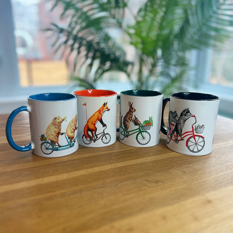 Rooster, hen and chicks riding a tandem bicycle Mug